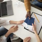 close-up-hands-holding-tickets